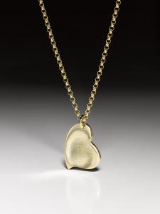 Silver necklace with a curved fingerprint heart pendant in fine silver